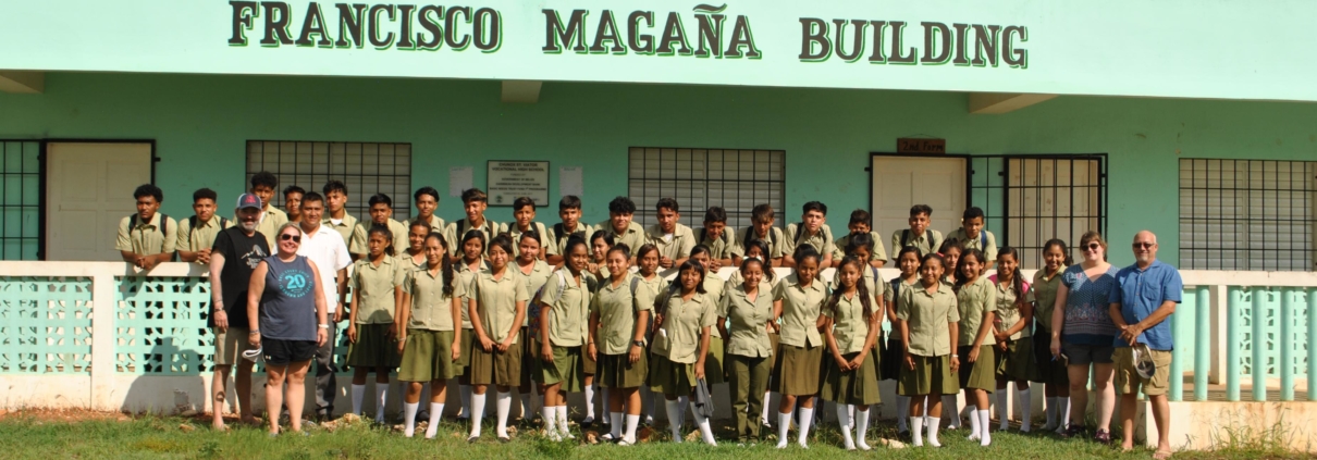 Large group of scholarship students in front of the Francisco Magana Building