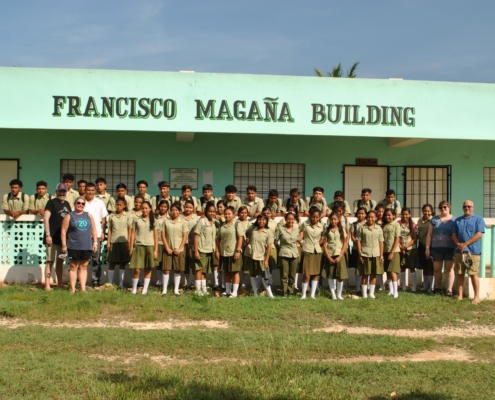 Large group of scholarship students in front of the Francisco Magana Building